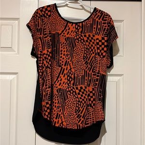 Black and orange top with design on front